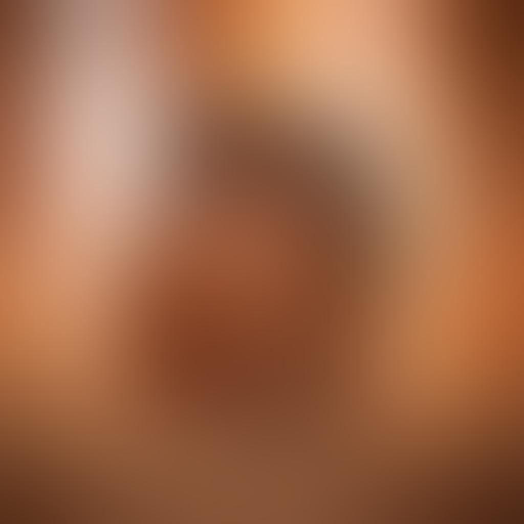 A sensual and intimate scene featuring a diverse couple embracing in a soft-lit bedroom, surrounded by elements symbolizing connection like intertwined hands and closed eyes. The background is adorned with flowing drapes and ambient candles, evoking a sense of warmth and safety. Illustrate symbols of empowerment like blooming flowers and radiant light. The overall mood is tender and inviting, inviting the viewer to explore themes of pleasure and intimacy. vibrant colors. soft focus. romantic style.